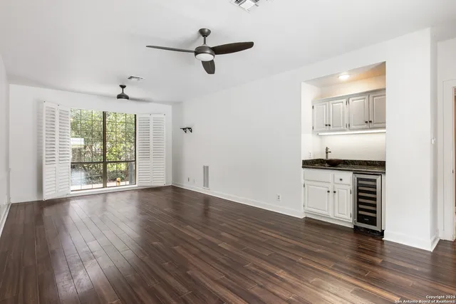 a view of a kitchen with a stove cabinets and wooden floor