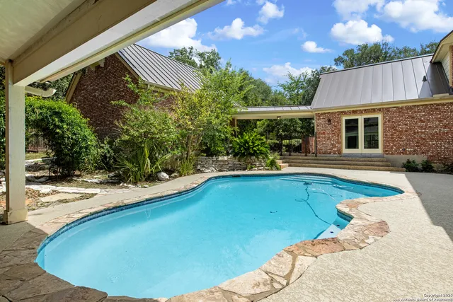 a view of a house with swimming pool