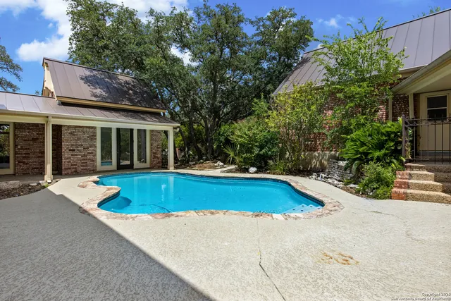 a view of outdoor space yard swimming pool and porch