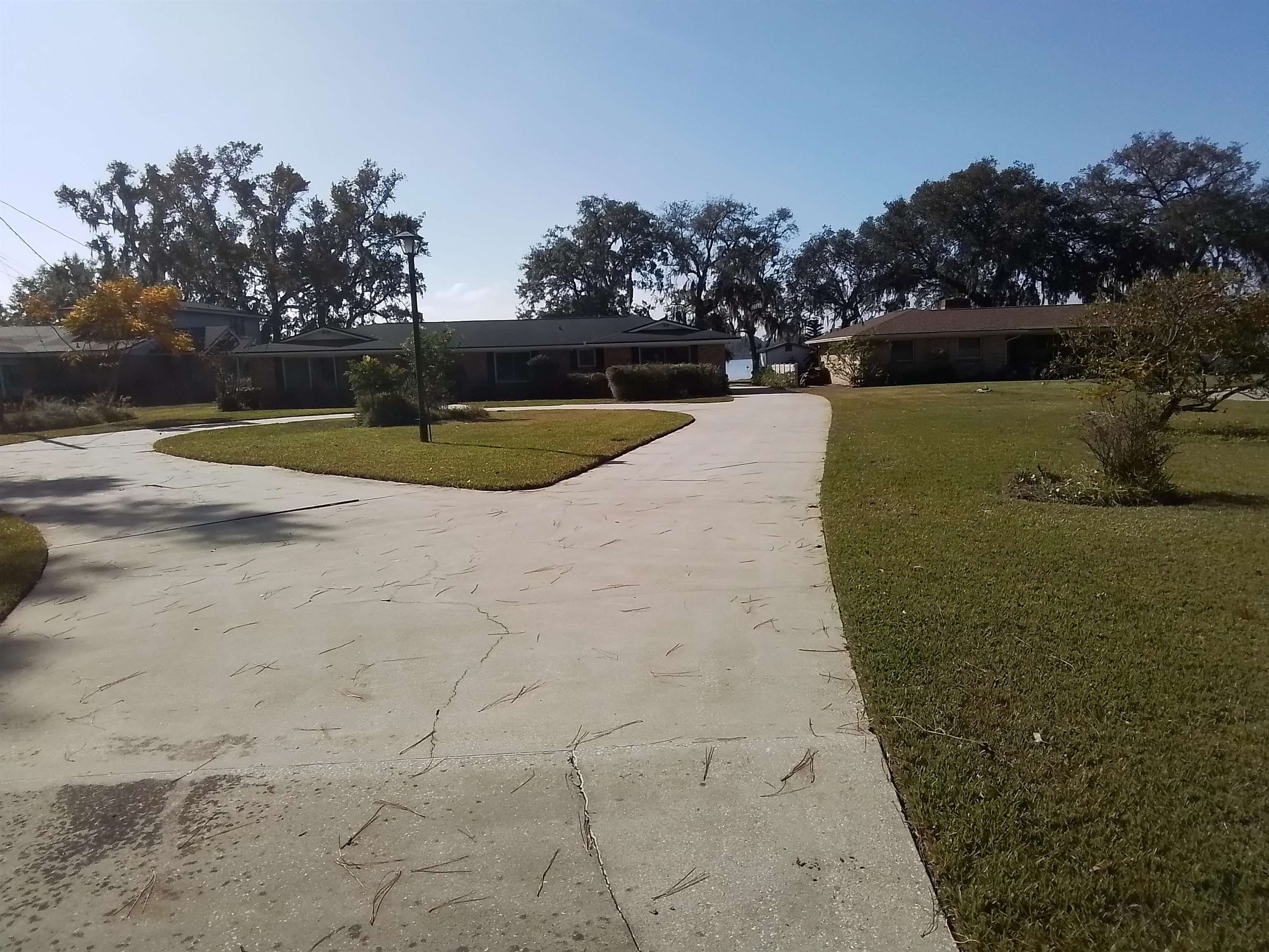 a view of a swimming pool with a yard