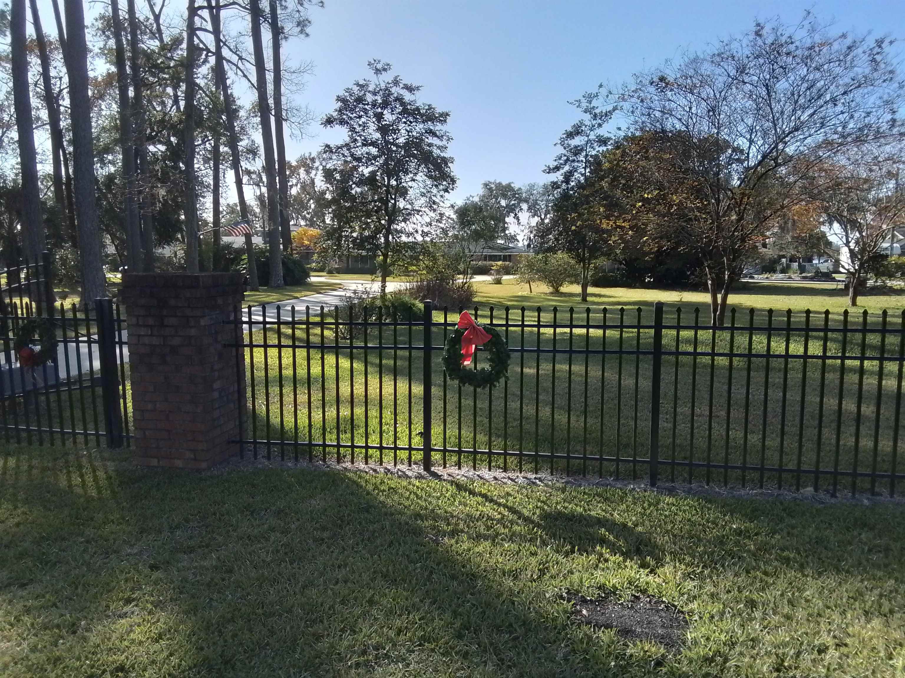 450 Broward Road Jacksonville, FL 32218 - Photo 2 of 13 a view of a backyard with a trees