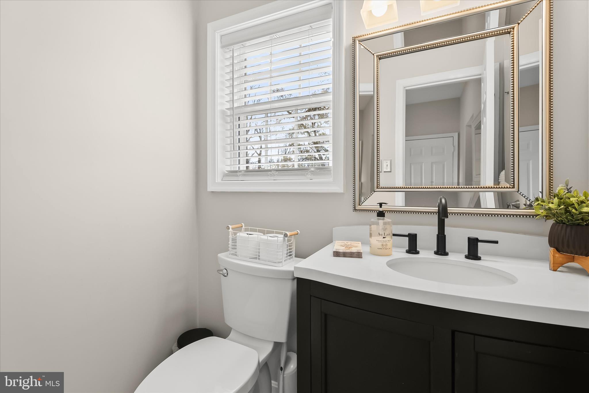 22 Farm Ridge Court Baldwin, MD 21013 - Photo 28 of 57 a bathroom with a toilet sink and mirror