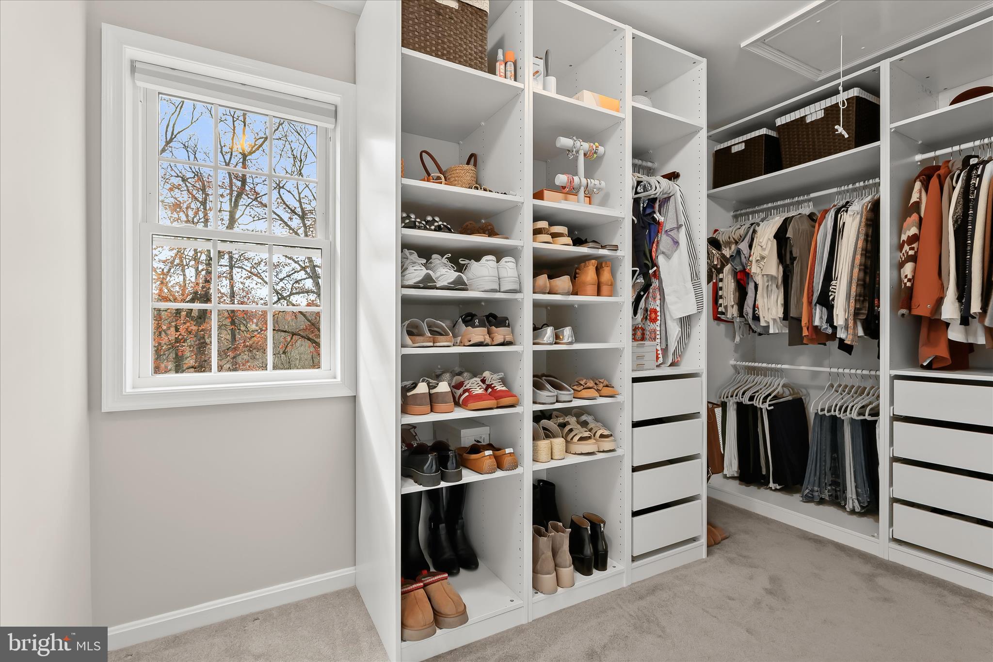 22 Farm Ridge Court Baldwin, MD 21013 - Photo 36 of 57 a view of walk in closet with clothes and shoes