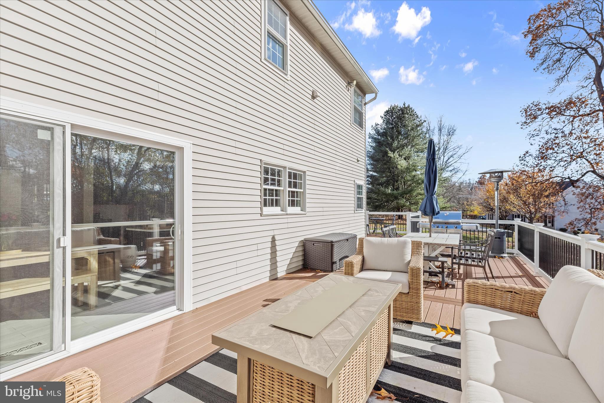 22 Farm Ridge Court Baldwin, MD 21013 - Photo 46 of 57 a view of a patio with couches table and chairs and potted plants