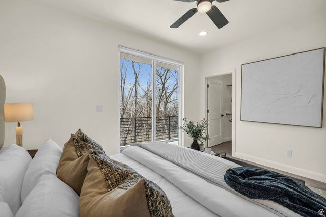 4016 South Burch Way Ogden, UT 84405 - Photo 11 of 30 Spacious room featuring floor-to-ceiling sliding glass doors, a private balcony with black metal railings, a ceiling fan with integrated lighting, recessed lighting, and a white paneled door leading to a closet