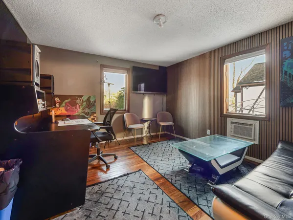 a living room with furniture rug and window
