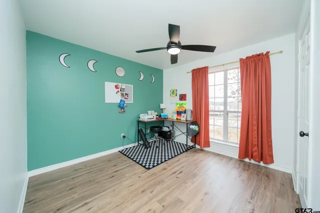 a bedroom with furniture and a window