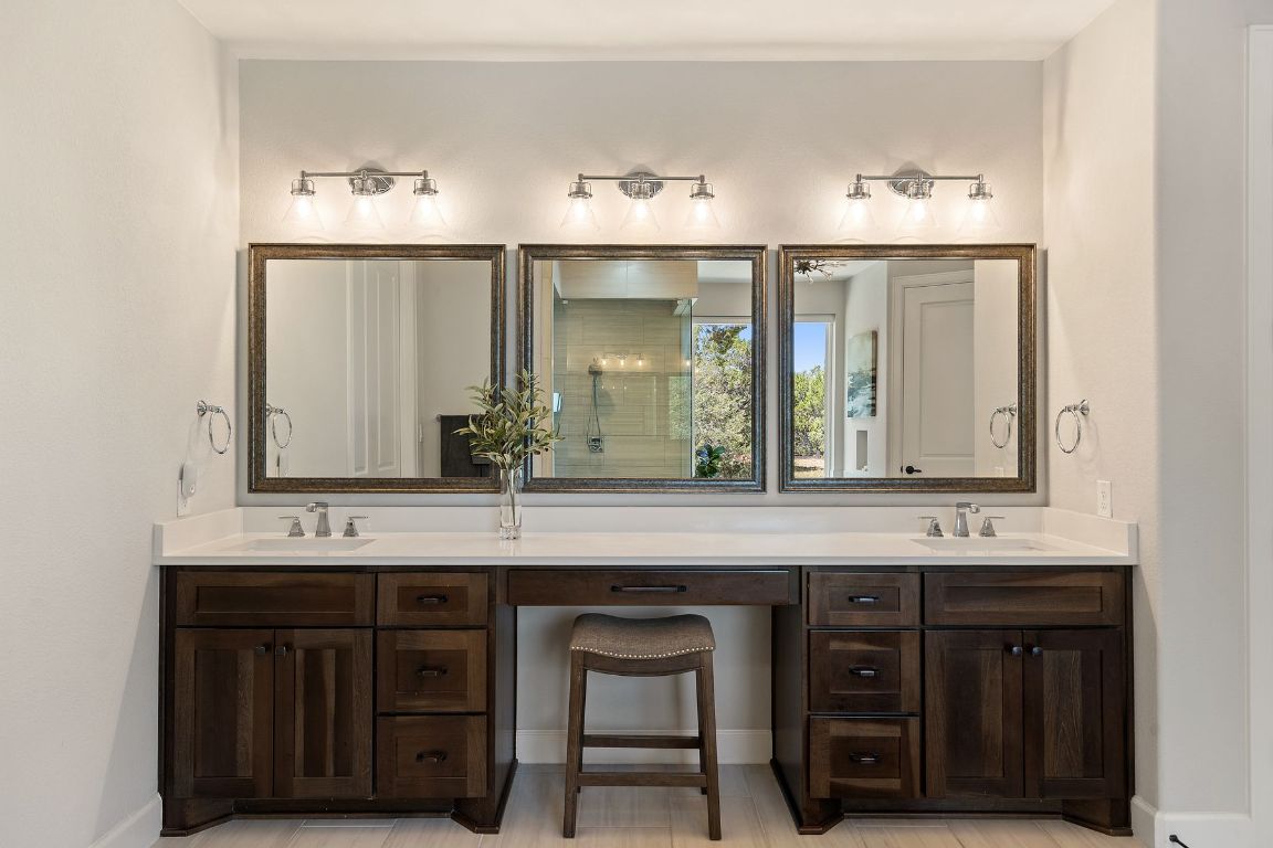 291 Southwick Ranch Road Johnson City, TX 78636 - Photo 19 of 40 Bathroom with double vanity and a stall shower