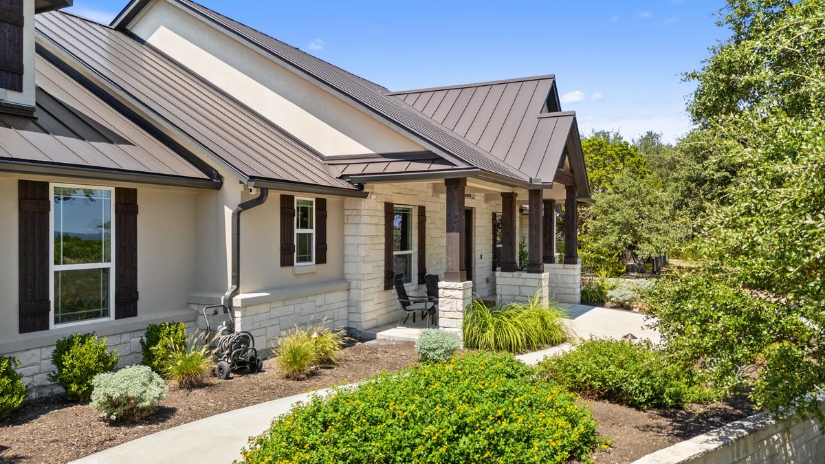 291 Southwick Ranch Road Johnson City, TX 78636 - Photo 2 of 40 Landscaped front with sidewalk to the entry