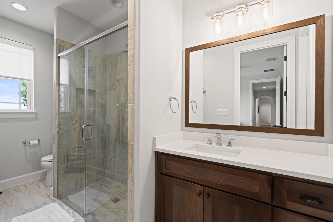 291 Southwick Ranch Road Johnson City, TX 78636 - Photo 24 of 40 Bathroom with vanity, a shower stall, and recessed lighting