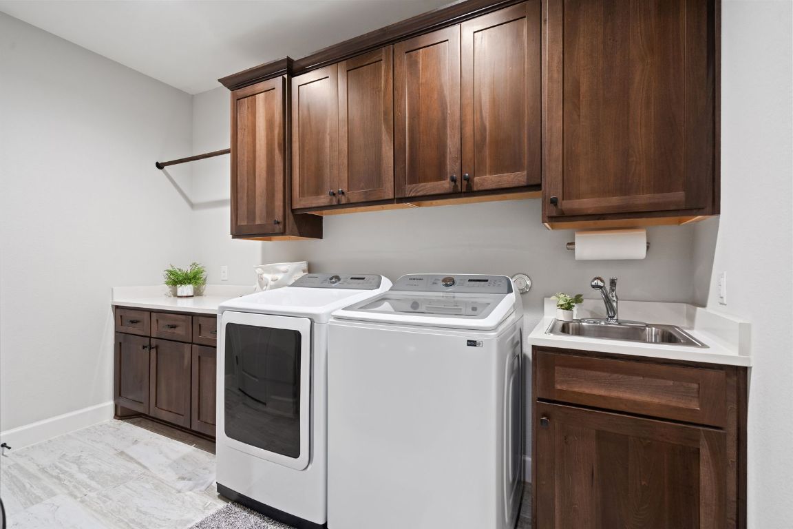 291 Southwick Ranch Road Johnson City, TX 78636 - Photo 27 of 40 Washroom with cabinet space and separate washer and dryer