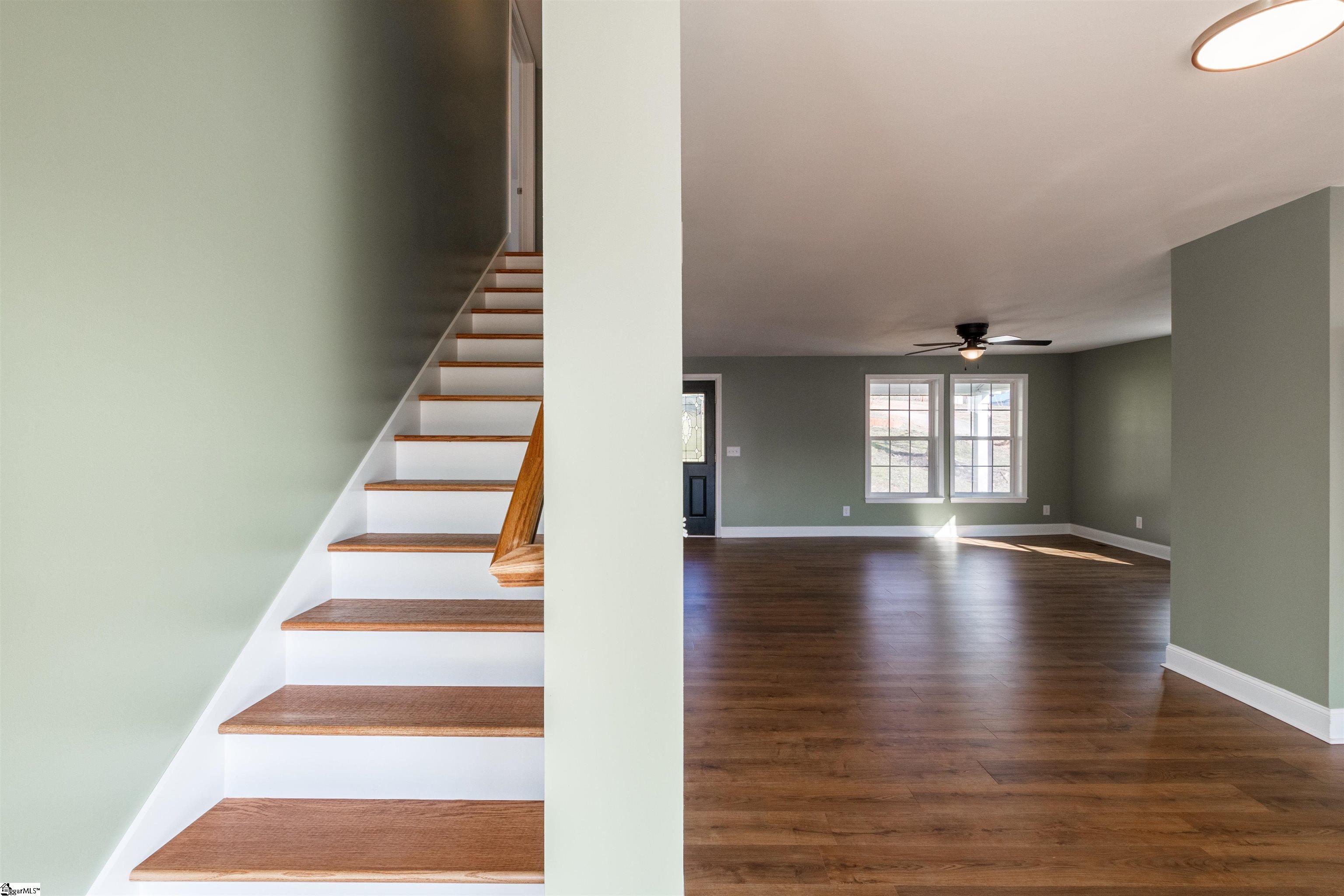 4 Maple Street Startex, SC 29377 - Photo 17 of 35 No carpet present in the home not even on the stairs. Hardwood treds are stained and ready to grant you access to the upstairs rooms.