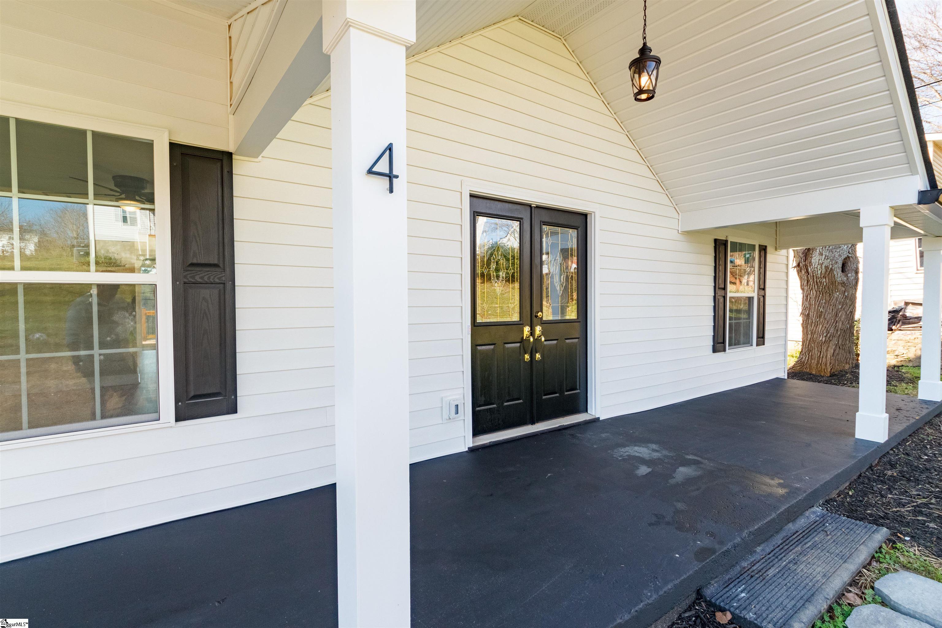 4 Maple Street Startex, SC 29377 - Photo 5 of 35 Welcome your guests to your new home with a covered front porch spacious enough for furniture and then enter through the double doors great for parties and moving your furniture in.