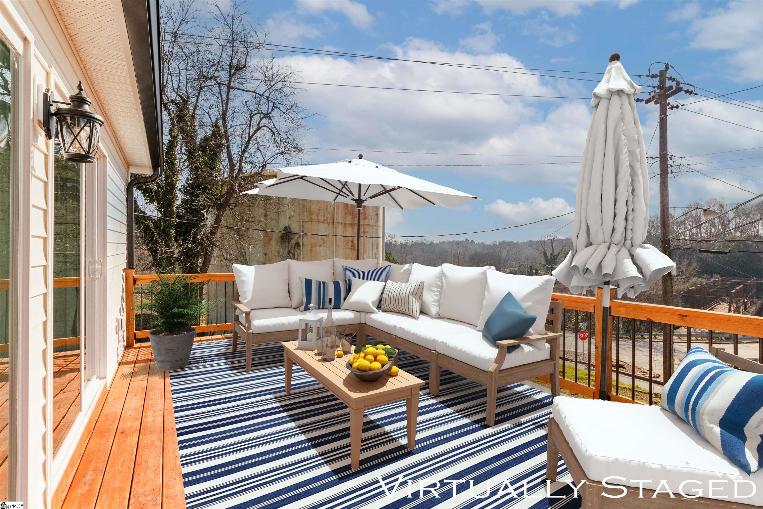 4 Maple Street Startex, SC 29377 - Photo 10 of 35 Two sets of sliding doors opening up the interior to the past/present/future of Startex. Spacious new deck with access to backyard overlooking Middle Tyger River