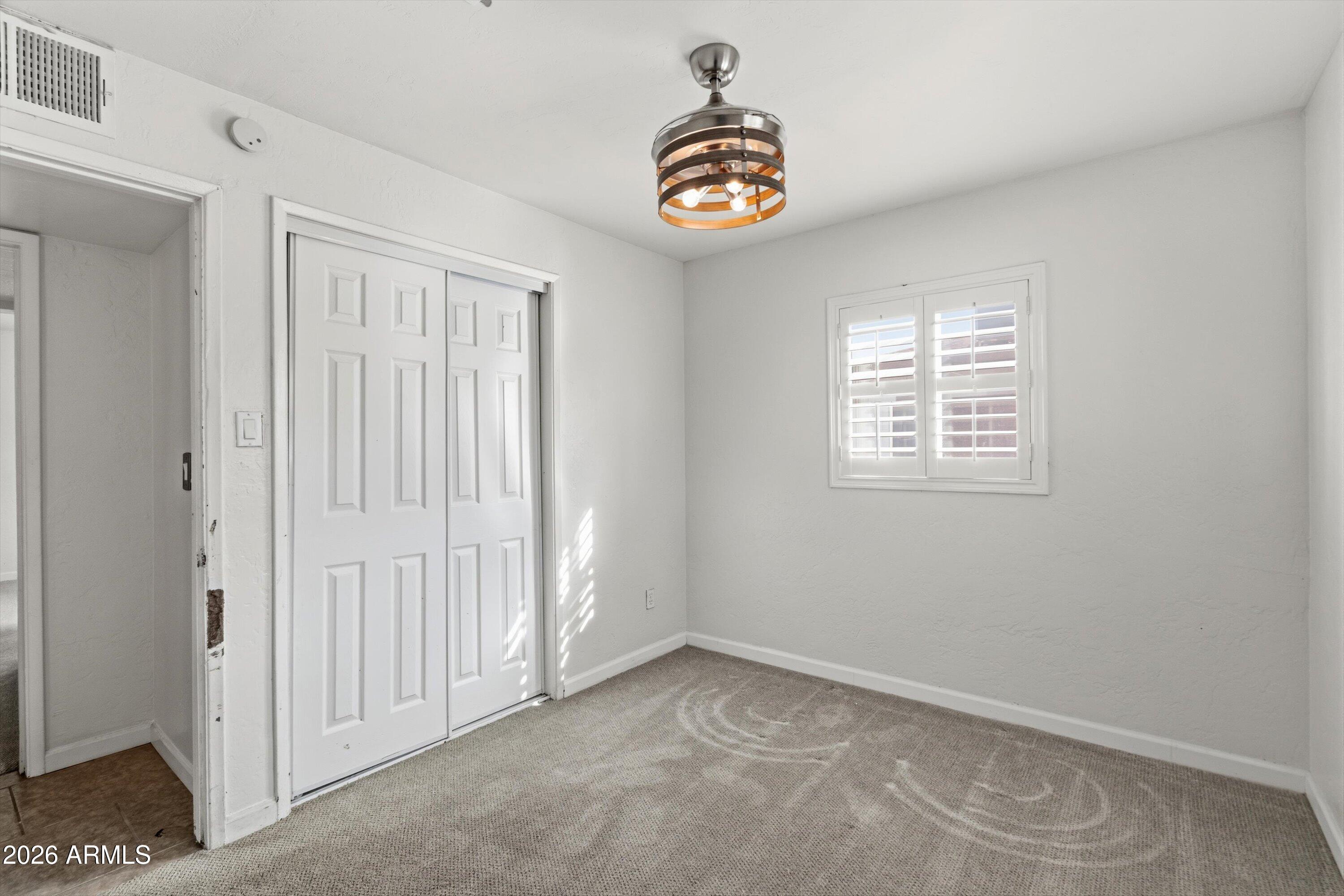 6246 North 23rd Avenue Phoenix, AZ 85015 - Photo 18 of 30 an empty room with a window