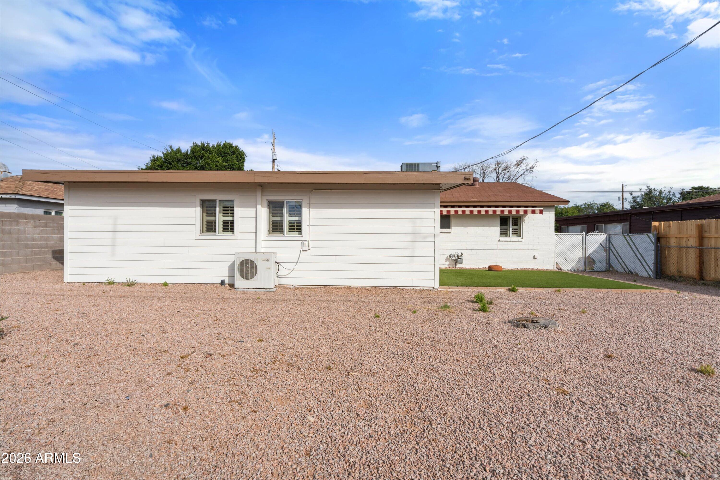 6246 North 23rd Avenue Phoenix, AZ 85015 - Photo 29 of 30 a front view of a house with a yard