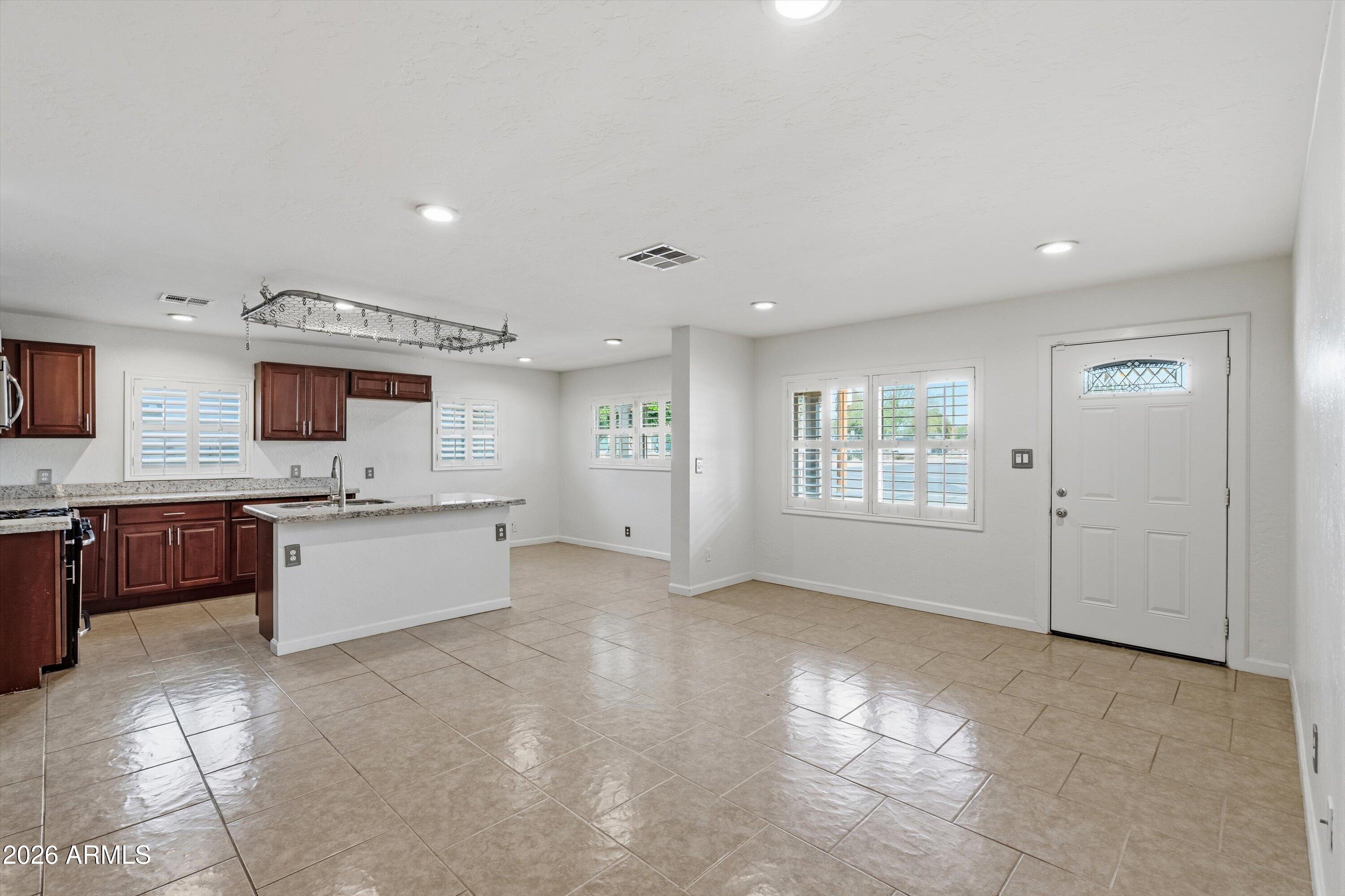 6246 North 23rd Avenue Phoenix, AZ 85015 - Photo 7 of 30 a large white kitchen with a large window
