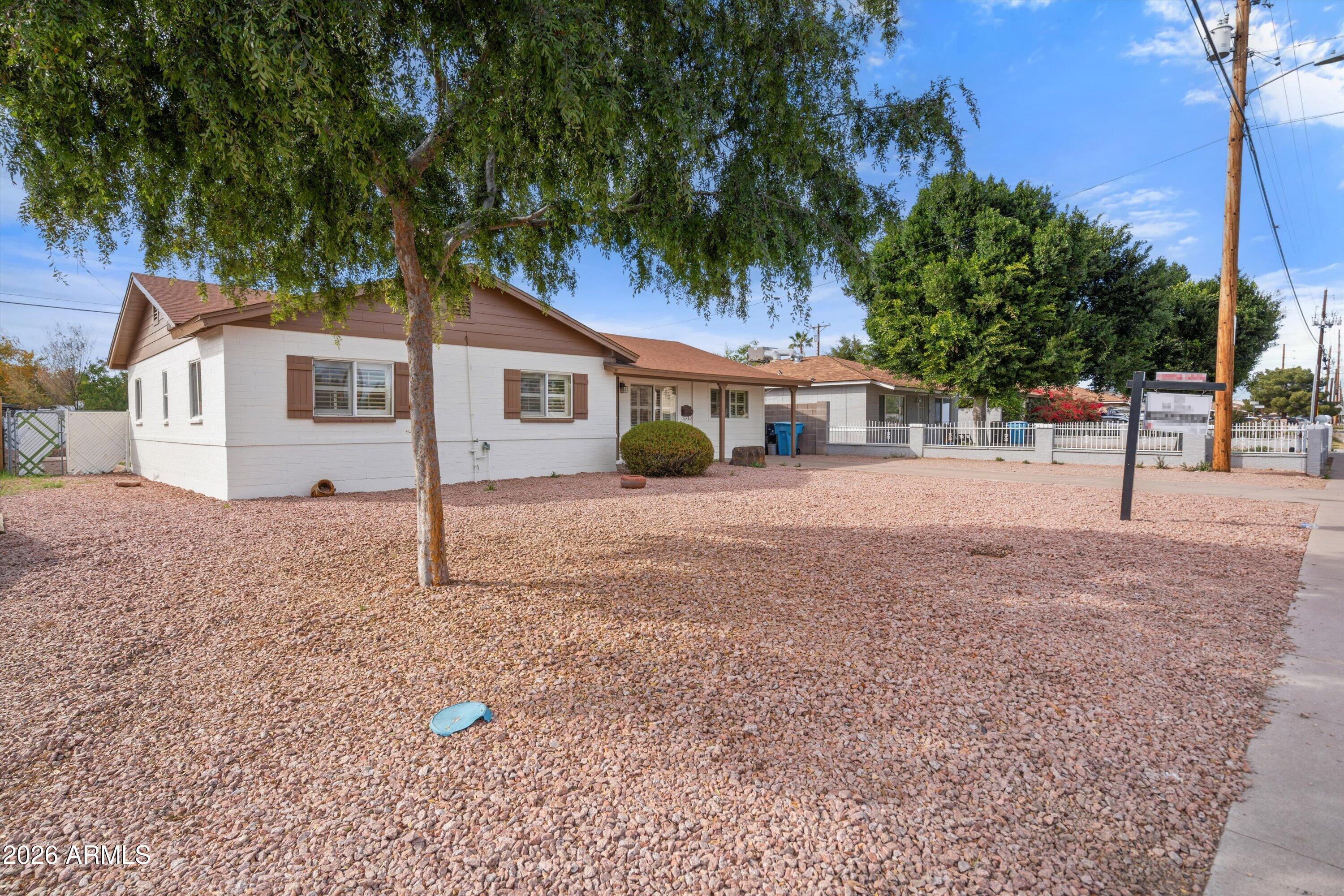 6246 North 23rd Avenue Phoenix, AZ 85015 - Photo 9 of 30 a house with trees in the background