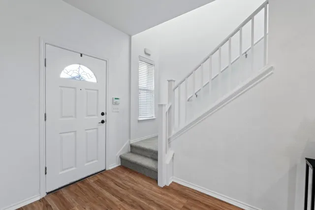 a view of entryway with wooden floor
