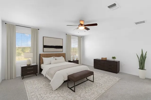 a bedroom with a bed and a couch