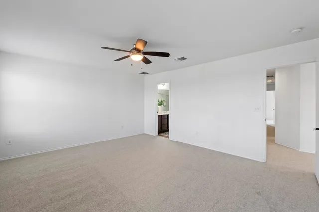 a view of a big room with carpet