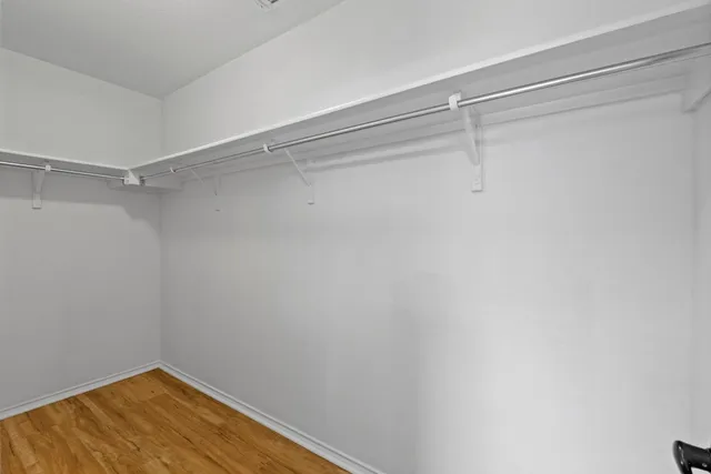 a view of a room with shelf on the wall
