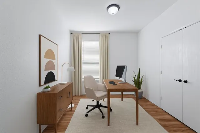 a view of a workspace with furniture and entryway
