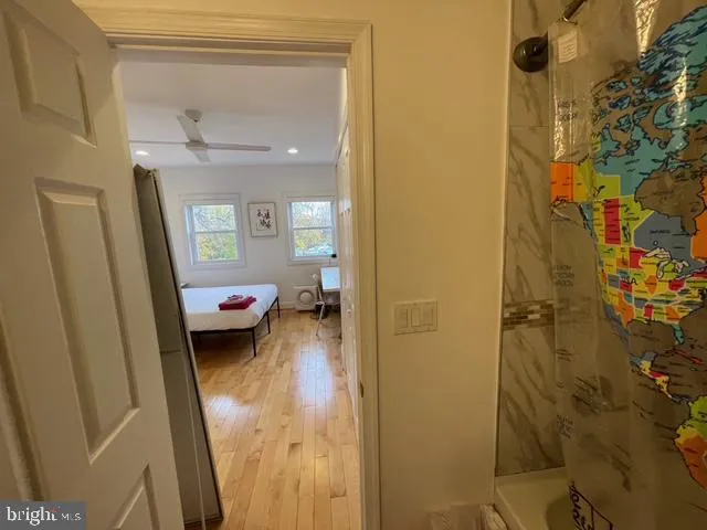 a bedroom with furniture and a window