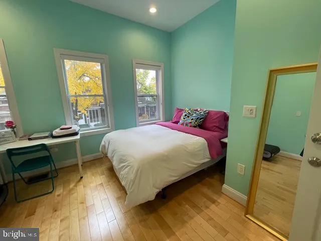 a room with furniture and painting on the wall