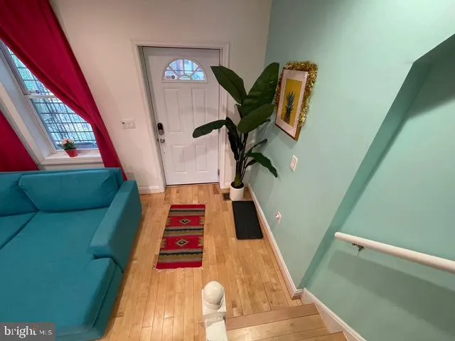 a bathroom with a toilet a sink and a mirror