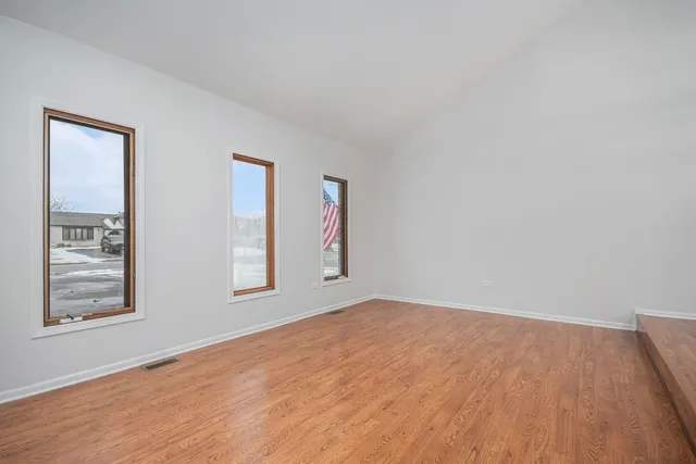 a view of room with window and ceiling fan