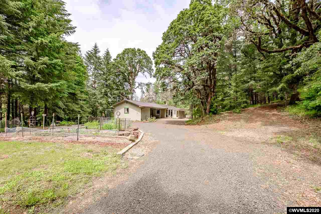 4890 Liberty Road Dallas, OR 97338 - Photo 41 of 42 a house with trees in front of it