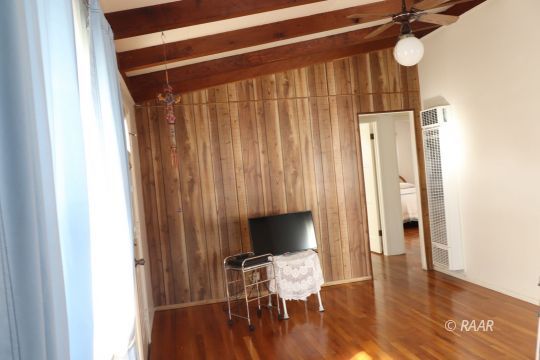 400 North Norma Street Ridgecrest, CA 93555 - Photo 10 of 20 a view of a room with wooden floor lounge chair and windows