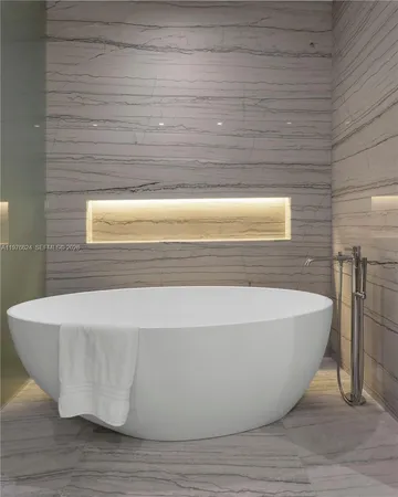 a view of a bathtub in a bathroom