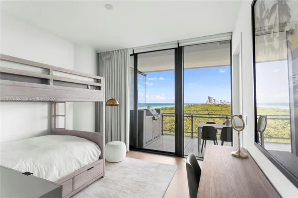 a bedroom with a bed and a mirror