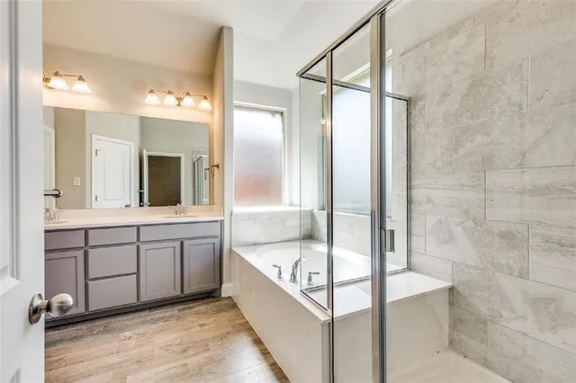 a bathroom with a bathtub and a sink