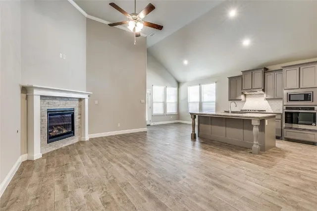 a view of kitchen with cabinets and wooden floor