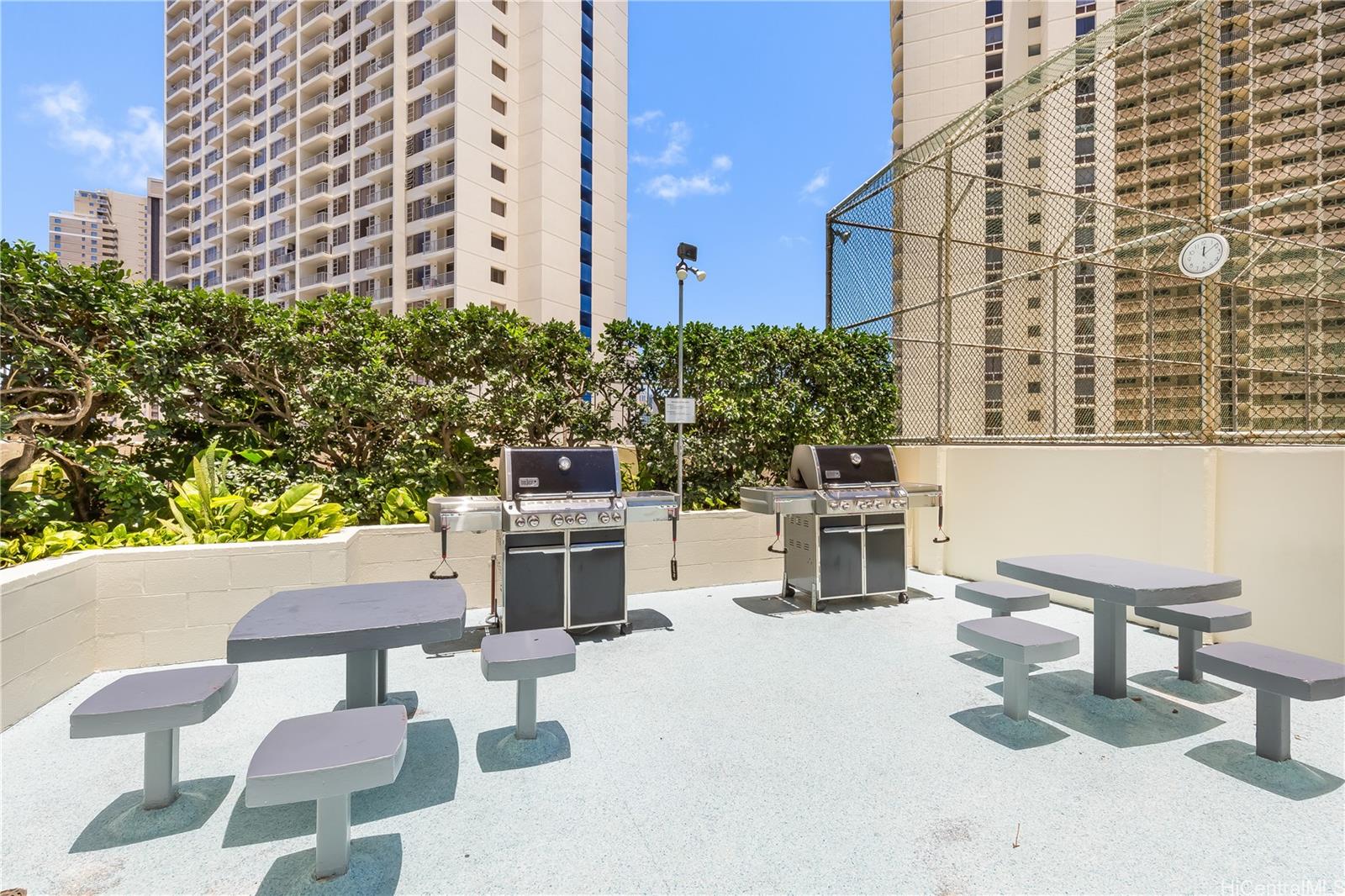 469 Ena Road, Unit 2102 Honolulu, HI 96815 - Photo 5 of 15 a balcony with table and chairs