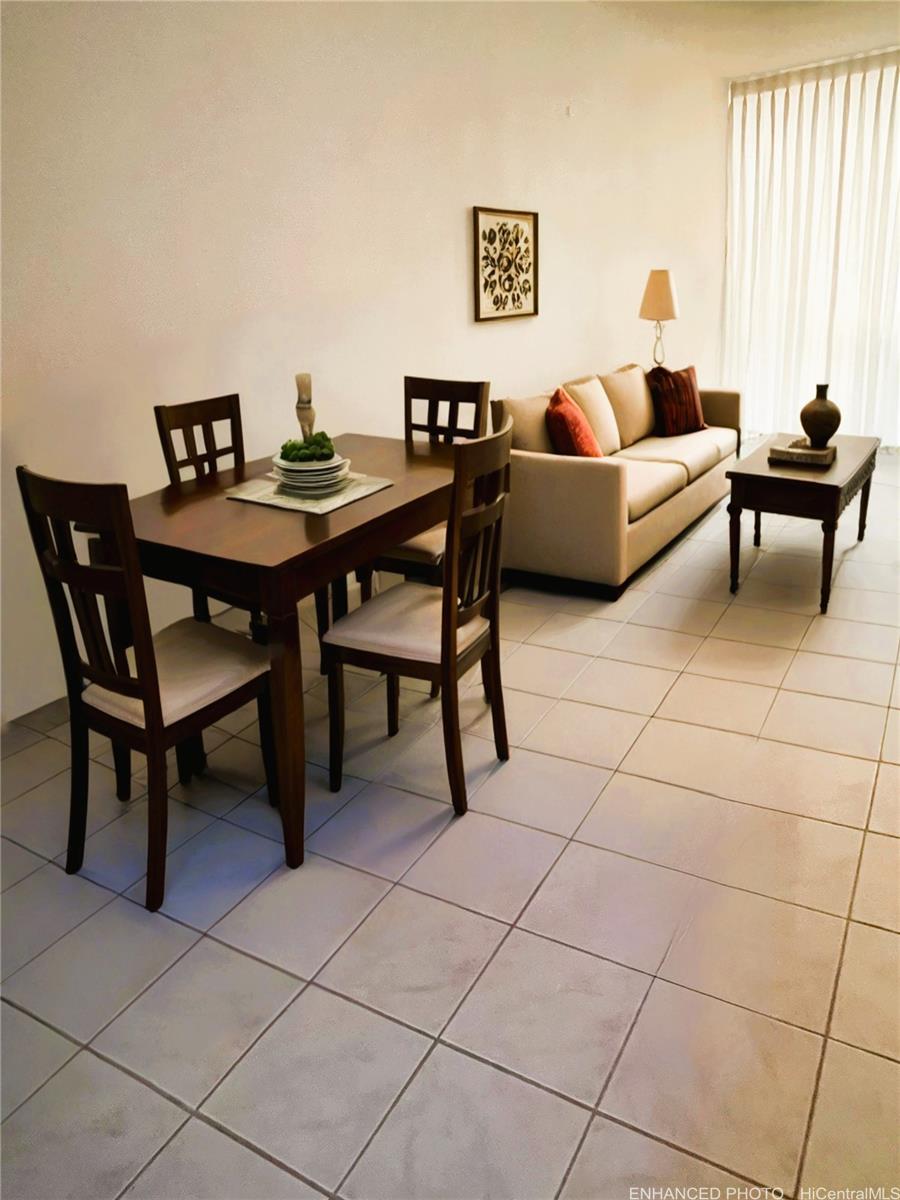 469 Ena Road, Unit 2102 Honolulu, HI 96815 - Photo 8 of 15 a living room with furniture and a table