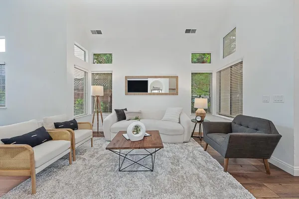 a living room with furniture and a large window