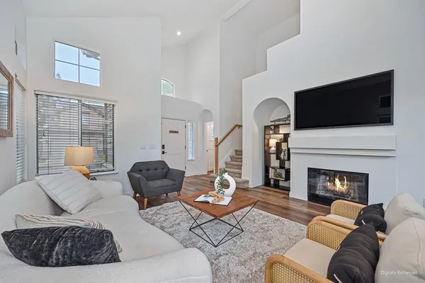 a view of entryway with wooden floor and stairs