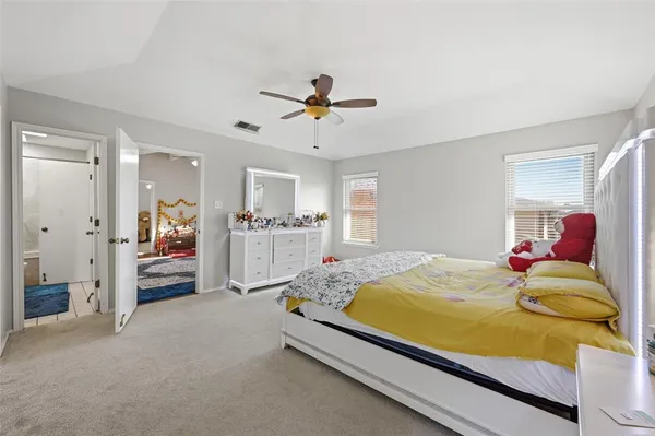 a bed room with a bed and a chandelier