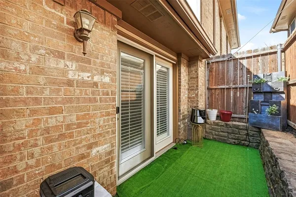 a view of front door with outdoor seating