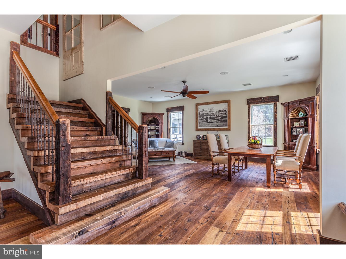 2103 Street Road New Hope, PA 18938 - Photo 14 of 25 a living room with furniture and a dining table with wooden floor