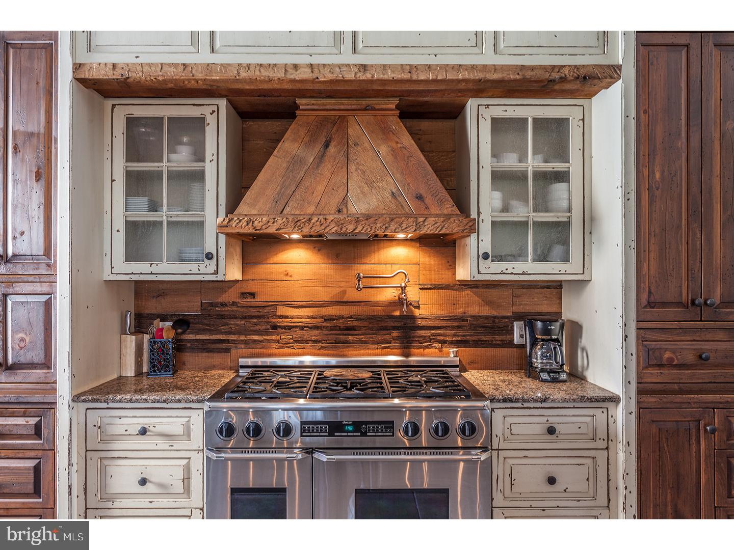2103 Street Road New Hope, PA 18938 - Photo 10 of 25 a kitchen with granite countertop a stove and a white cabinet