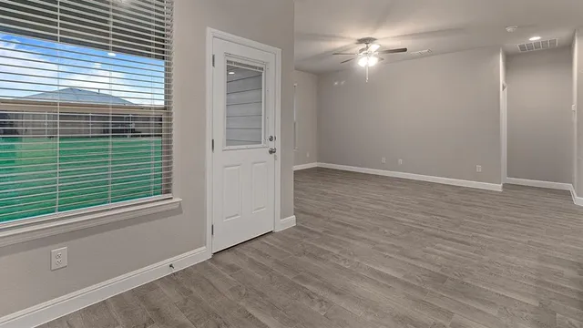 a bathroom with a sink a vanity and a large mirror