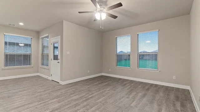 a view of kitchen with sink and refrigerator