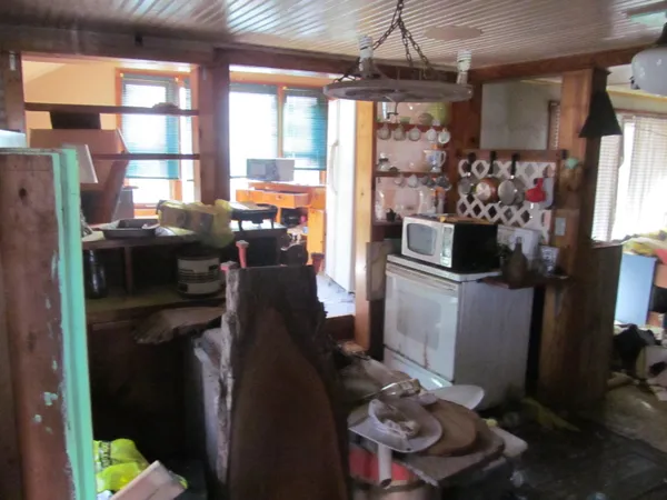 a kitchen with a refrigerator and a window