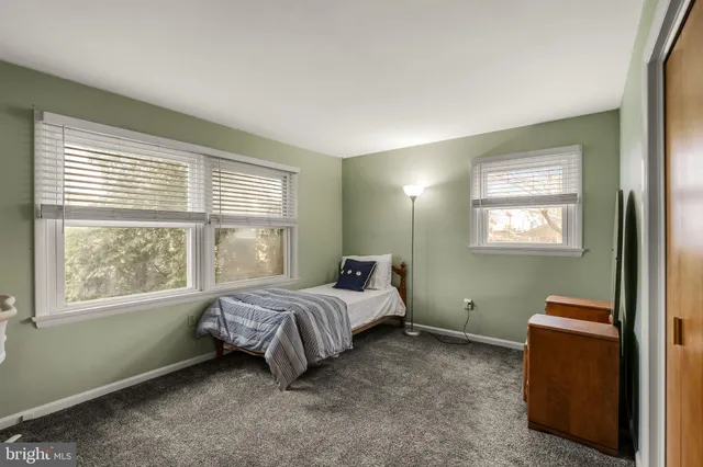 a room with a bed and a window