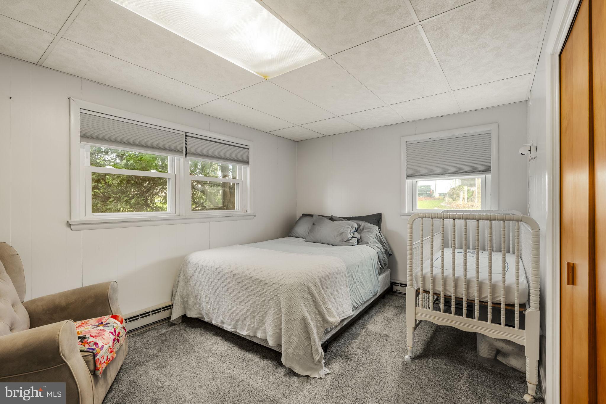 119 Harristown Road Paradise, PA 17562 - Photo 20 of 25 a bedroom with a bed and a window